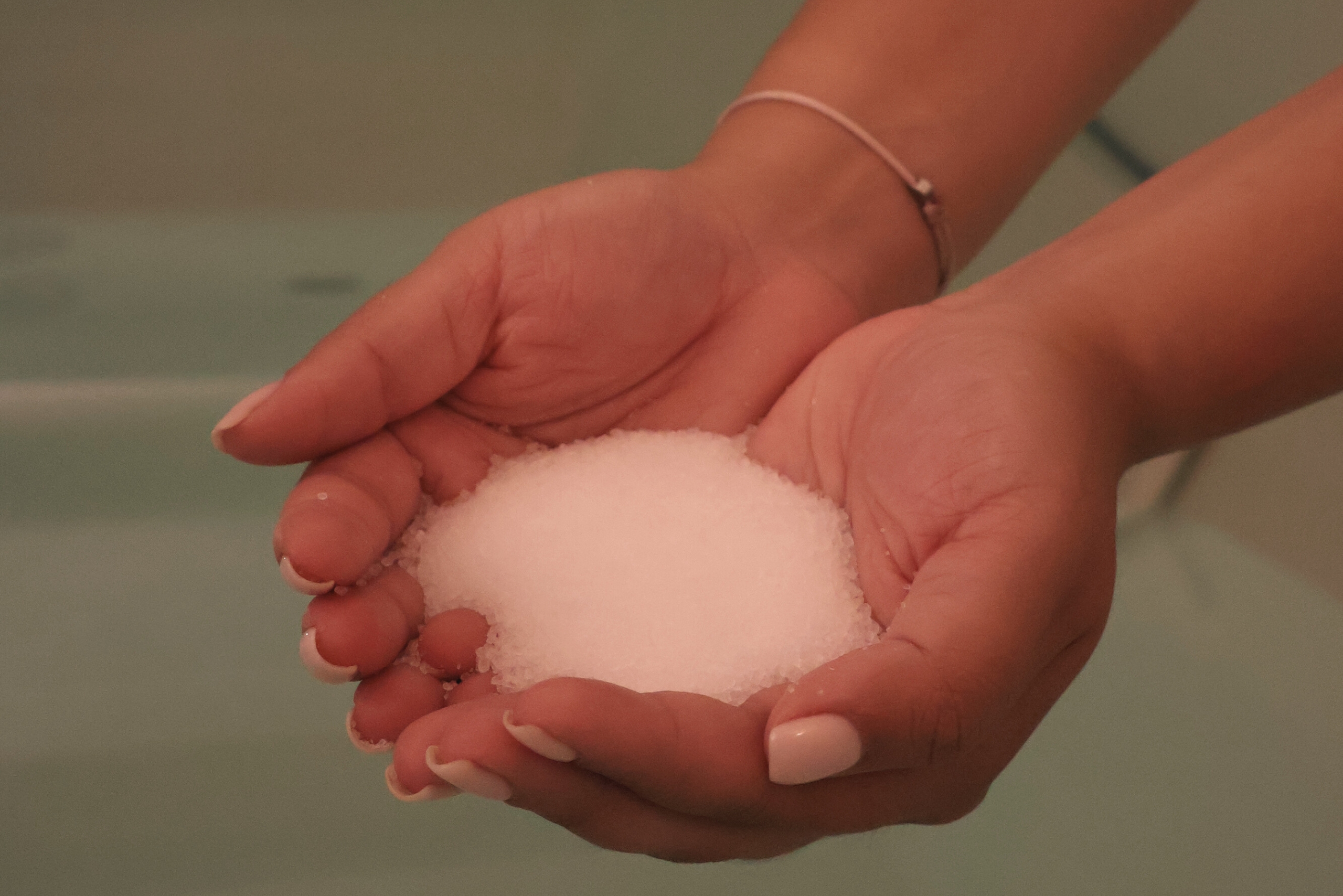 Person floating peacefully in a float cabin filled with Epsom salt solution at Koan Float Amsterdam